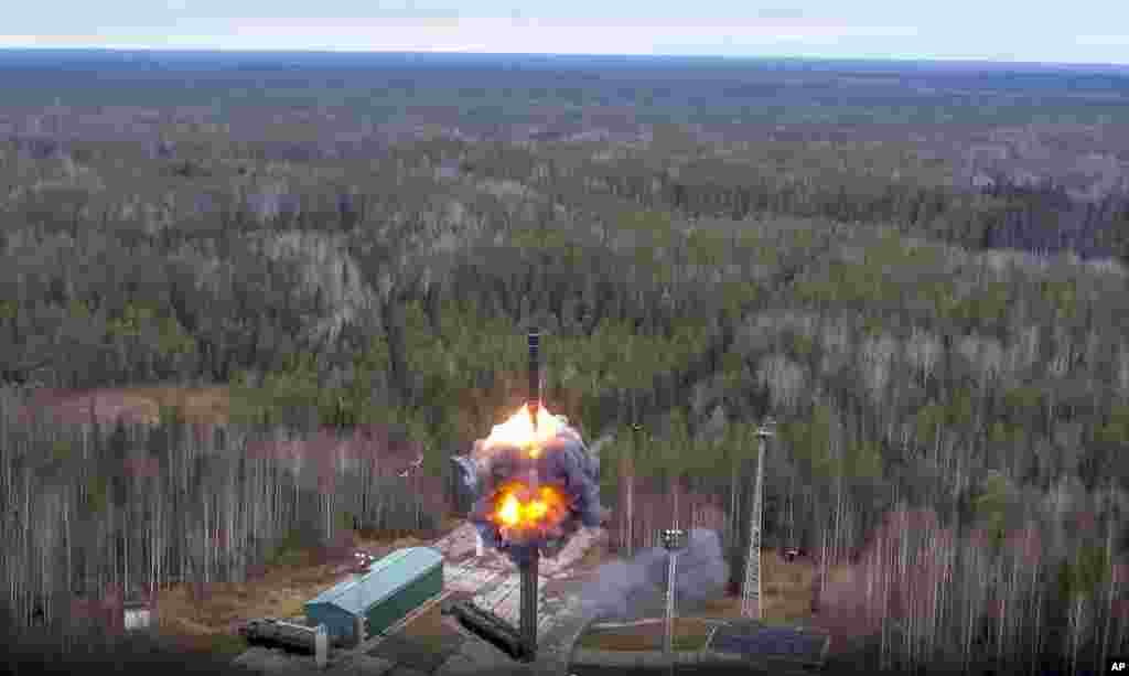 In this handout photo taken from video released by the Russian Defense Ministry Press Service, an RS-24 Yars intercontinental ballistic missile is test-fired as part of Russia's nuclear drills, from a launch site in Plesetsk, Russia.