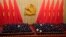 Attendees bow their heads to observe a moment of silence for fallen comrades during the opening ceremony of the 20th National Congress of China's ruling Communist Party held at the Great Hall of the People in Beijing, China, Oct. 16, 2022.