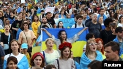 People march during a "Freedom Parade" on Ukraine's Independence Day, as Russia's invasion of Ukraine continues, in Berlin, Germany, Aug. 24, 2022.