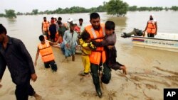Army troops rescue people from a flood-hit area in Rajanpur, district of Punjab, Pakistan, August 27, 2022.(AP Photo/Asim Tanveer)