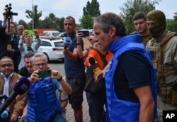 Director General of the International Atomic Energy Agency (IAEA) Rafael Mariano Grossi speaks to the media as a mission of the International Atomic Energy Agency prepare to visit the Zaporizhzhia nuclear power plant, in Zaporizhzhia, Ukraine, Thursday, S