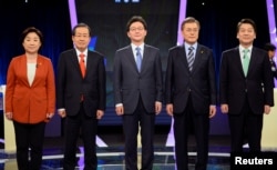FILE - (L-R) Sim Sang-jung, candidate of the leftist Justice Party, Hong Joon-pyo, candidate of the conservative Liberty Korea Party, Yoo Seung-min, candidate of the conservative Bareun Party, Moon Jae-in, candidate of the liberal Democratic Party of Korea.