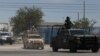 Members of the National Guard and the Mexican army leave the airport after landing in Ciudad Juarez, Chihuahua, Mexico, on Aug. 12, 2022, after a rash of violence in the city.