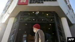 A man walks past the Moscow's stock market building in downtown Moscow on Feb. 28, 2022