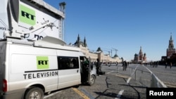 FILE PHOTO: Vehicles of Russian state-controlled broadcaster RT are seen in Red Square in central Moscow