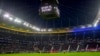 Teams pay a minute of silence for the people in Ukraine during a German Bundesliga soccer match between Eintracht Frankfurt and Bayern Munich in Frankfurt, Germany, Feb. 26, 2022. 
