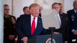FILE - President Donald Trump addresses the nation from the White House on the ballistic missile strike that Iran launched against Iraqi air bases housing U.S. troops, Jan. 8, 2020, in Washington. 