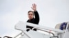 Secretary of State Antony Blinken waves as he boards a plane to depart, Thursday, March 3, 2022 at Andrews Air Force Base, Maryland.