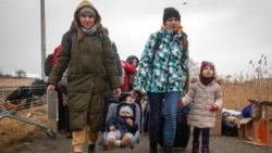 Refugees, mostly women with children, arrive at the border crossing in Medyka, Poland, March 5, 2022, after fleeing the Russian invasion in Ukraine. 