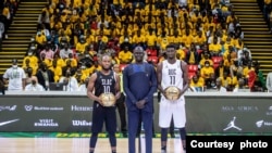 Mamadi Keita (S.L.A.C.), BAL President Amadou Gallo Fall and Abel Abdourahmane Diop (DUC) at BAL 2022 opening game in Dakar, Senegal.