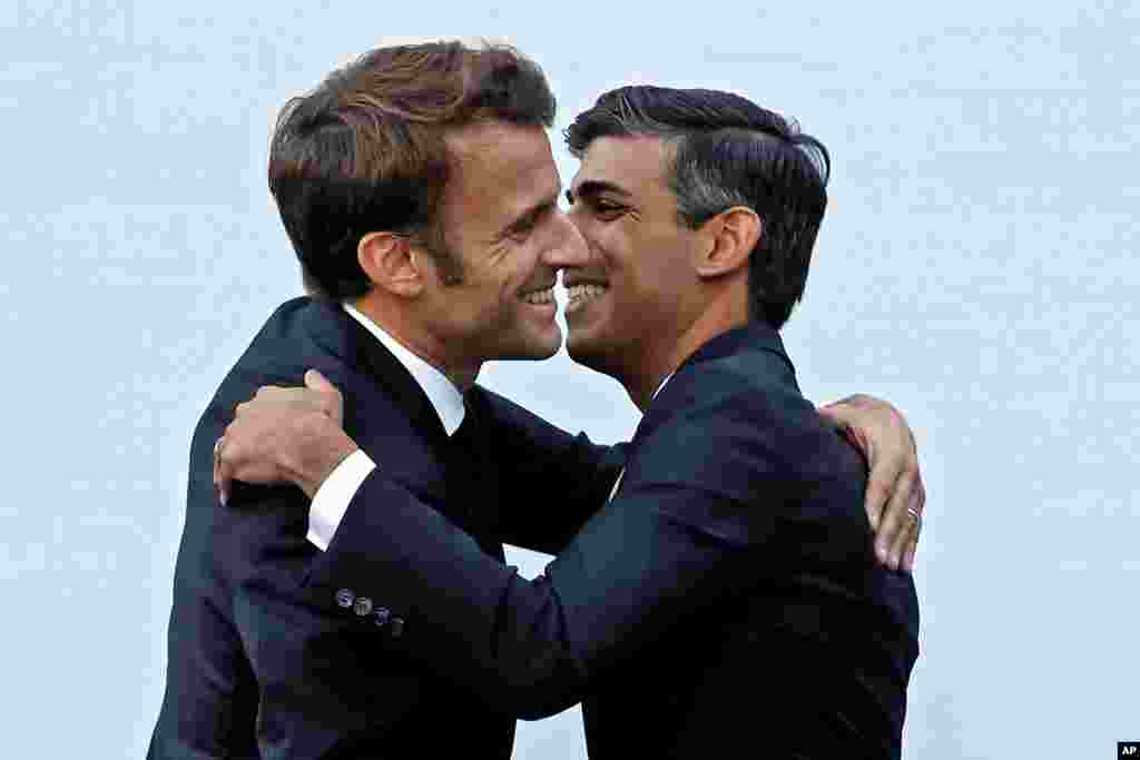 Britain's Prime Minister Rishi Sunak, right, hugs French President Emmanuel Macron during a bilateral meeting at the COP27 summit, in Sharm el-Sheikh, Egypt.