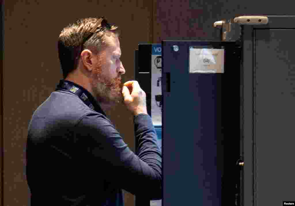 A man votes in midterm elections at the Center for Civil and Human Rights in Atlanta, Georgia, Nov. 8, 2022. 