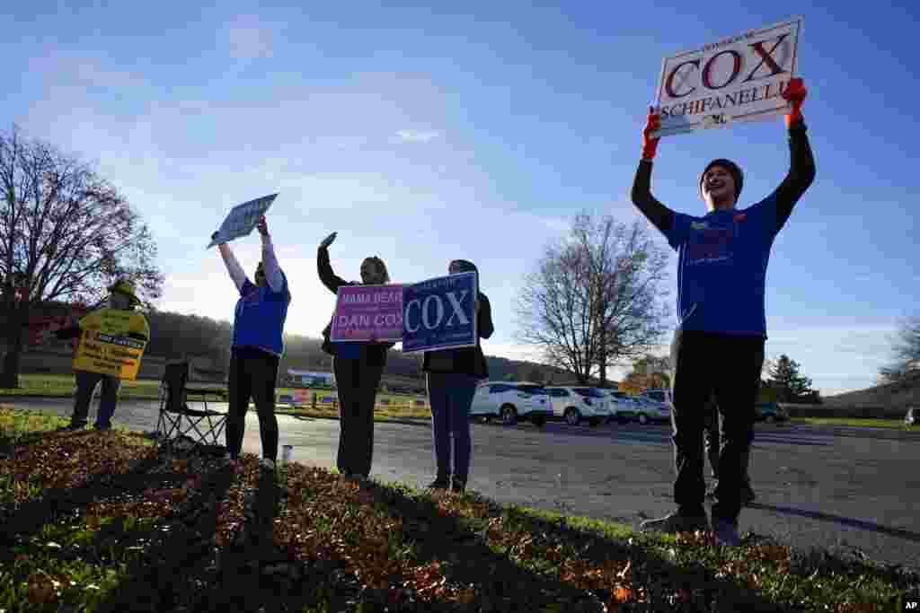 Supporters for Dan Cox, Republican gubernatorial candidate in Maryland, react as he arrives to cast his vote at Sabillasville Elementary School, Nov. 8, 2022, in Sabillasville, Maryland.