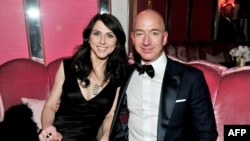 (FILES) In this file photo taken on February 26, 2017 (L-R) CEO of Amazon Jeff Bezos and his wife writer MacKenzie Bezos attend the Amazon Studios Oscar Celebration at Delilah in West Hollywood, California. - The announcement by Amazon founder Jeff Bezos