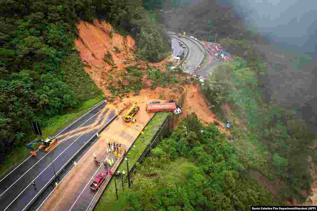 The BR-367 highway is seen blocked after a landslide in Guaratuba, Parana state, Brazil.&nbsp;Two people were found dead and at least 30 were missing in a landslide that swept away about 20 vehicles on a road in southern Brazil, firefighters estimated.
