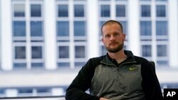 In this Dec. 31, 2020, photo, pardoned Blackwater contractor Evan Liberty poses for a photo in Washington. 