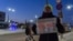 Ilya Kursov holds a sign that reads, "I wish for Putin to go away in the New Year." (Ilya Kursov)