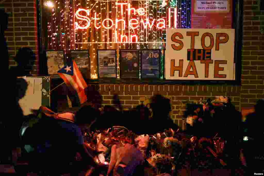 Memorial outside The Stonewall Inn, considered by many the center of New York's gay rights movement, following Pulse Orlando massacre, Manhattan, June 12, 2016.