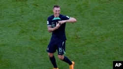 Australia's Mitchell Duke, center left, celebrates his goal during the World Cup group D soccer match between Tunisia and Australia at the Al Janoub Stadium in Al Wakrah, Qatar, Saturday, by forming a "J" with his fingers in a tribute to his son Jaxson, who was in the stands.