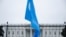 FILE - A Uyghur flag is held high on Pennsylvania Avenue in front of the White House during a protest against the Chinese Communist Party, Oct. 1, 2022.