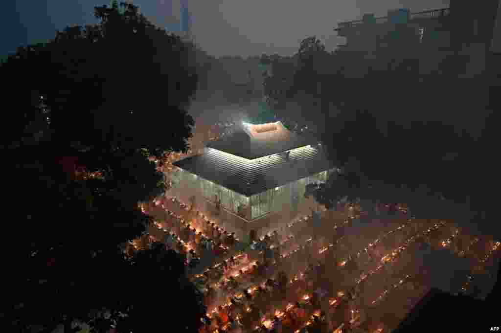 Hindu devotees offer prayers at the Shri Shri Lokanath Brahmachari temple during the Hindu religious fasting festival of 'Rakher Upobash' in Narayanganj, Bangladesh.