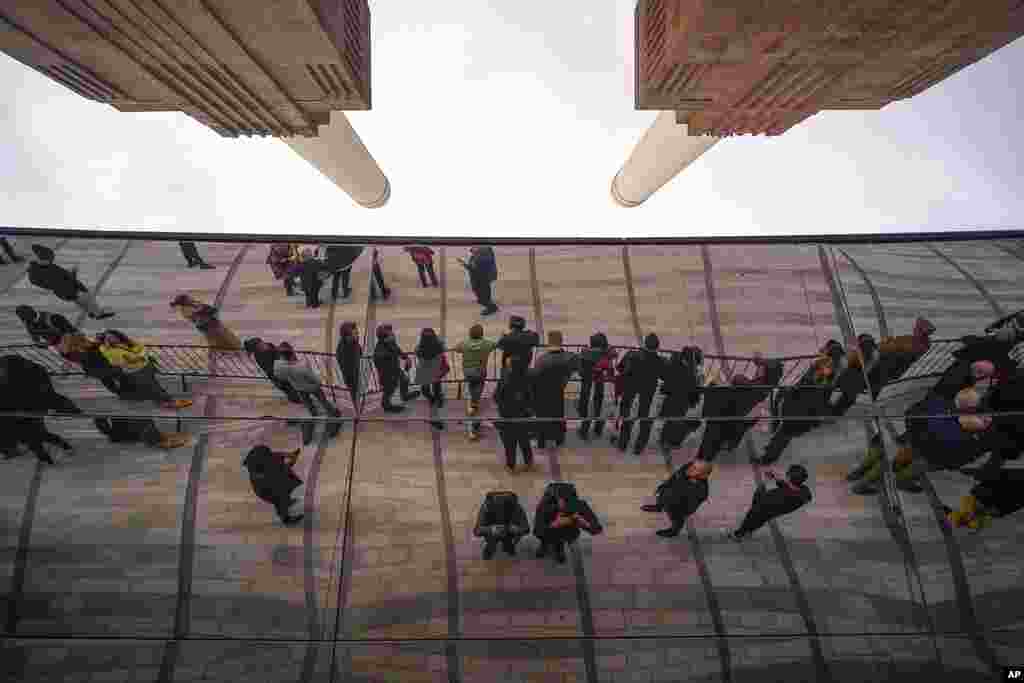 People wait for the opening of the Battersea Power Station, in London. A former power station on the bank of the River Thames that was left derelict for decades is opening after a 9 billion-pound ($10 billion) redevelopment turning the south London site into an attraction complete with shops, bars and apartments.&nbsp;