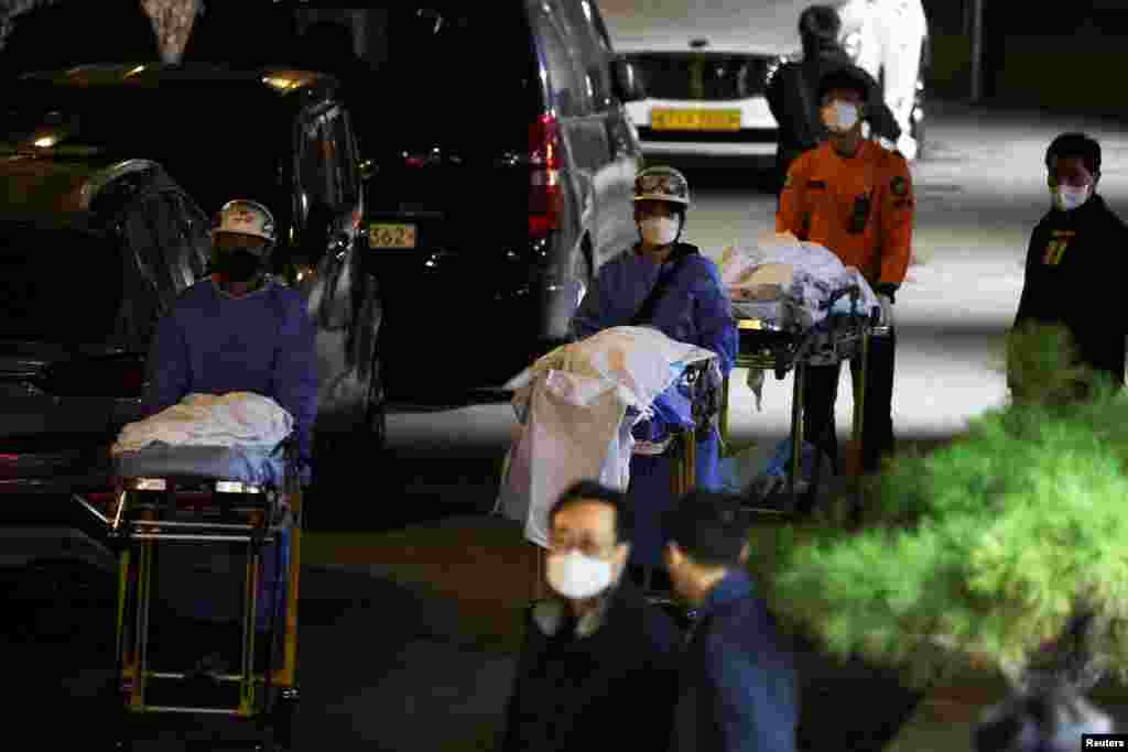 People move bodies to be transported from hospital, after a stampede during a Halloween festival in Seoul, South Korea. At least 151 people were killed and&nbsp;82 people were injured in the incident in Seoul's Itaewon area, which had been packed with crowds ahead of the Monday holiday, officials said.