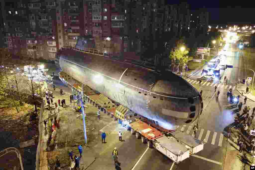 The bow of the Soviet submarine K-3 'Leninsky Komsomol' is transported from the pier to the museum in the city of Kronstadt, outside St. Petersburg, Russia.