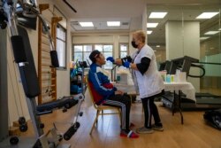 FILE - A man gets a PCR coronavirus test at a private nursing home in Netanya, Israel, Jan. 5, 2022.