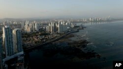 The setting sun lights up the Panama City skyline, April 4, 2016. A searchable database of a Panamanian law firm's documents revealing details of more than 200,000 offshore entities is to be released Monday.