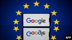 FILE - This picture taken on April 27, 2023 in Toulouse, southwestern France, shows a screen displaying the Google logo and the European flag.