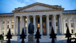The U.S. Treasury Department building at dusk, June 6, 2019, in Washington. 