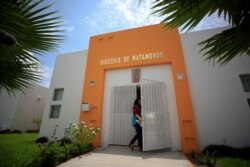 A worker enters the migrant shelter where Tania Vanessa Avalos has been receiving assistance since her husband and their daughter drowned Sunday when the family tried to cross the Rio Grande in Matamoros, Tamaulipas state, Mexico, June 26, 2019.