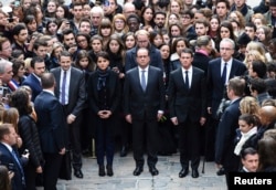 (From L) French Minister for Higher Education and Research Thierry Mandon, French Education Minister Najat Vallaud-Belkacem, French President Francois Hollande and French Prime Minister Manuel Valls observe a minute of silence at the Sorbonne University in Paris to pay tribute to victims of Friday's Paris attacks, France, Nov. 16, 2015.