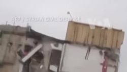 ساتی ڕووخانی باڵەخانەیەک لە شارۆچکەی جەرابلوس