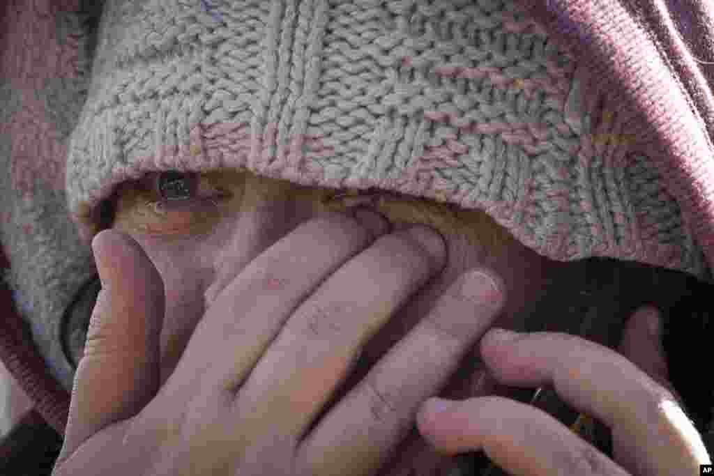 Masha Fesenko, from Kyiv, arrives at the border crossing in Medyka, Poland, March 8, 2022.&nbsp;Russia's invasion of Ukraine has set off the largest mass migration in Europe in decades, with more than 1.5 million people having crossed from Ukraine into neighboring countries.