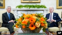 President Joe Biden meets with Singapore's Prime Minister Lee Hsien Loong in the Oval Office of the White House, March 29, 2022, in Washington.