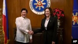 U.S. Vice President Kamala Harris, right, shakes hands with Philippine President Ferdinand Marcos Jr. at the Malacanang presidential palace in Manila, Philippines, Nov. 21, 2022.