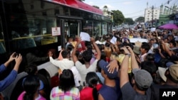Family members wait for prisoners to be released from Insein prison in Yangon on Jan. 4, 2023. 