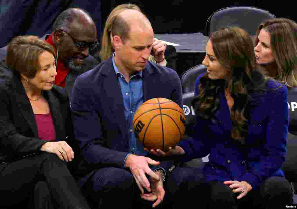 Massachusetts Governor-elect Maura Healey looks on as Britain's&nbsp;Catherine, Princess of Wales, handed a basketball to Prince William during the Wednesday night National Basketball Association game between the seventeen-time World Champion Boston Celtics and the Miami Heat at TD Garden in downtown Boston, Nov. 30, 2022.