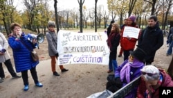 People gather outside the National Assembly in Paris, Nov. 24, 2022, as lawmakers in France's lower house of parliament began debating a proposal to enshrine abortion rights in the country's constitution. The measure later passed easily, but its future remains unclear.
