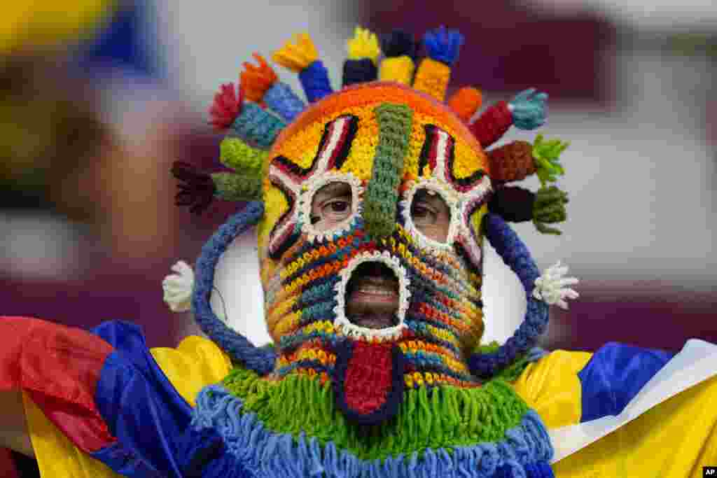 An Ecuador fan waits for the start of the World Cup group A soccer match between Ecuador and Senegal, at the Khalifa International Stadium in Doha, Qatar.