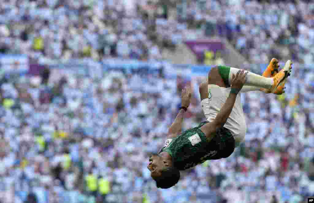 Saudi Arabia's Salem Al-Dawsari celebrates after scoring his side's second goal during the World Cup group C soccer match between Argentina and Saudi Arabia at the Lusail Stadium in Lusail, Qatar.