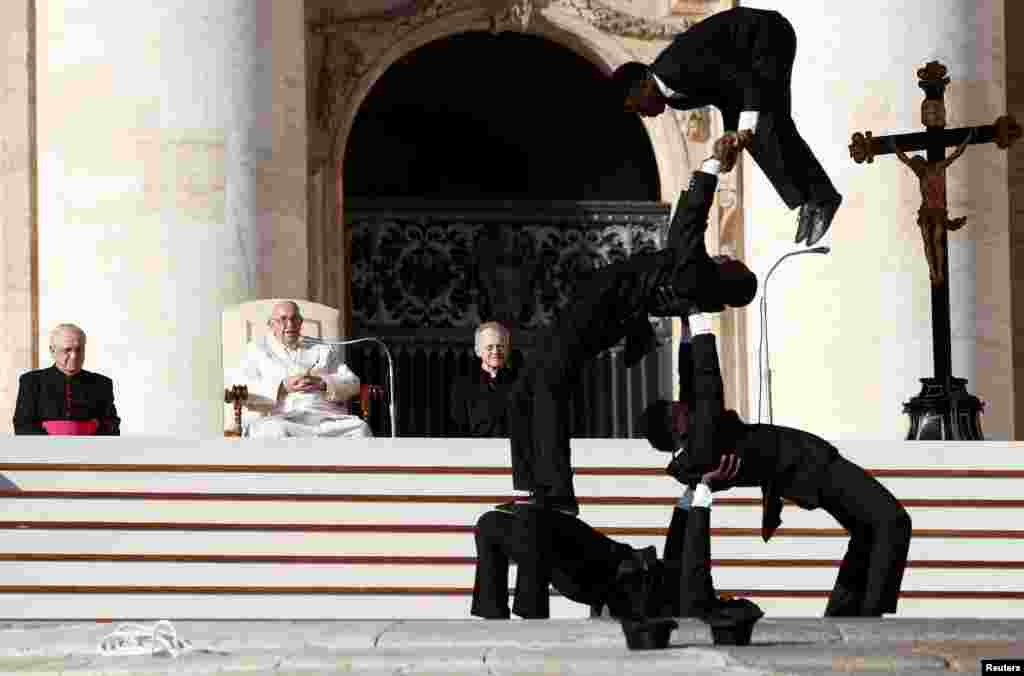 Circus members from Kenya perform during the weekly general audience held by Pope Francis in St. Peter's Square at the Vatican.