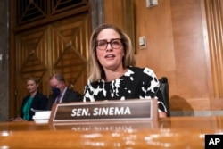 FILE - Sen. Kyrsten Sinema, Aug. 3, 2022