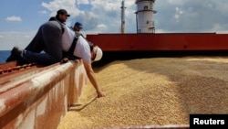 The Joint Coordination Center officials are seen onboard the 'Razoni' cargo ship during an inspection in the Black Sea off Kilyos, near Istanbul, Aug. 3, 2022. (Turkish Defence Ministry/Handout via Reuters) 