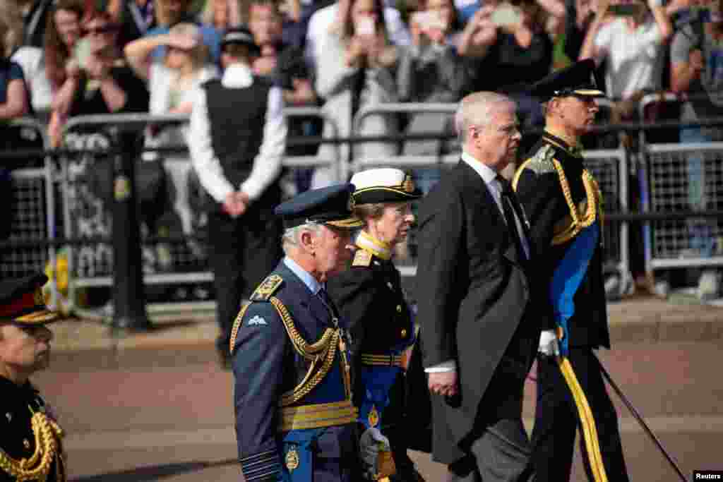 Britain's King Charles III, Princess Anne, Prince Andrew and Prince Edward follow the coffin of Queen Elizabeth II during a procession from Buckingham Palace to Westminster Hall in London, Sept. 14, 2022.