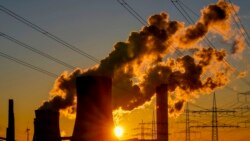FILE - Steam comes out of chimneys of a coal-fired power station in Niederaussem, Germany, Oct. 24, 2021.