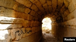 Graffiti on the ancient ruins of the Greek and Roman city of Cyrene, is seen in Shahhat, Libya October 20, 2018. Picture taken October 20, 2018. REUTERS/Esam Omran Al-Fetori
