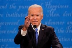 Democratic presidential candidate former Vice President Joe Biden gestures while speaking during the second and final presidential debate Thursday, Oct. 22, 2020, at Belmont University in Nashville, Tenn. (AP Photo/Julio Cortez)